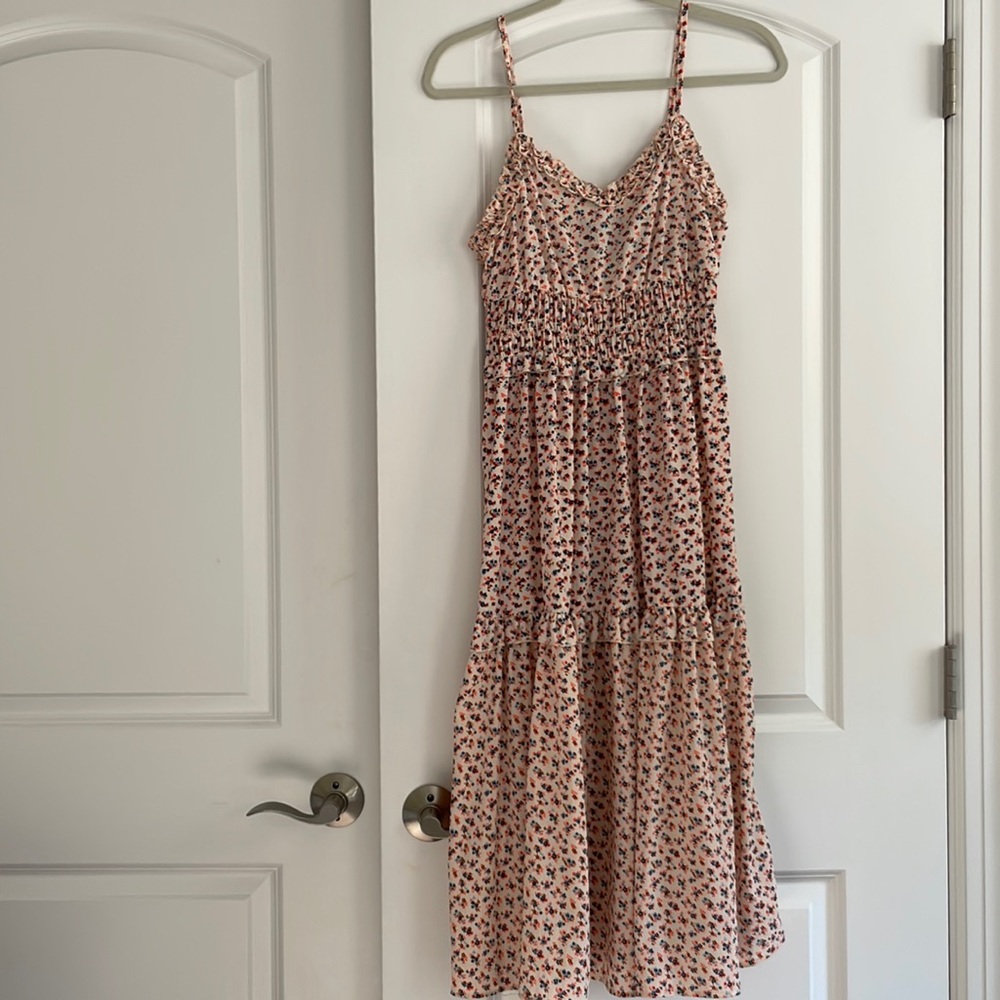 Multi colored floral dress with adjustable spaghetti straps by Angie. Size Small